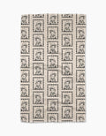 The Geometry Ready For Summer Doggy beige Geoweave™ tea towel features a grid of dotted square borders framing repeated black line drawings of a dog in glasses and a scarf.
