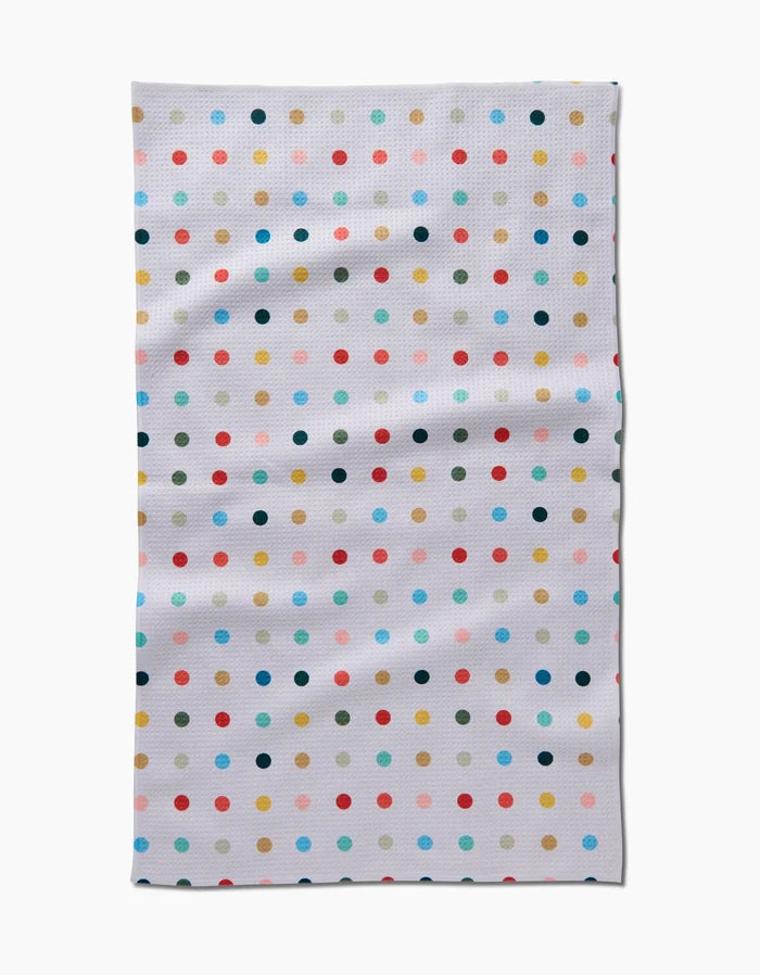 The Elizabeth Edwards Retro Dot Tea Towel features ultra-absorbent Geoweave fabric and a white grid design with colorful polka dots in red, orange, blue, green, yellow, and black.