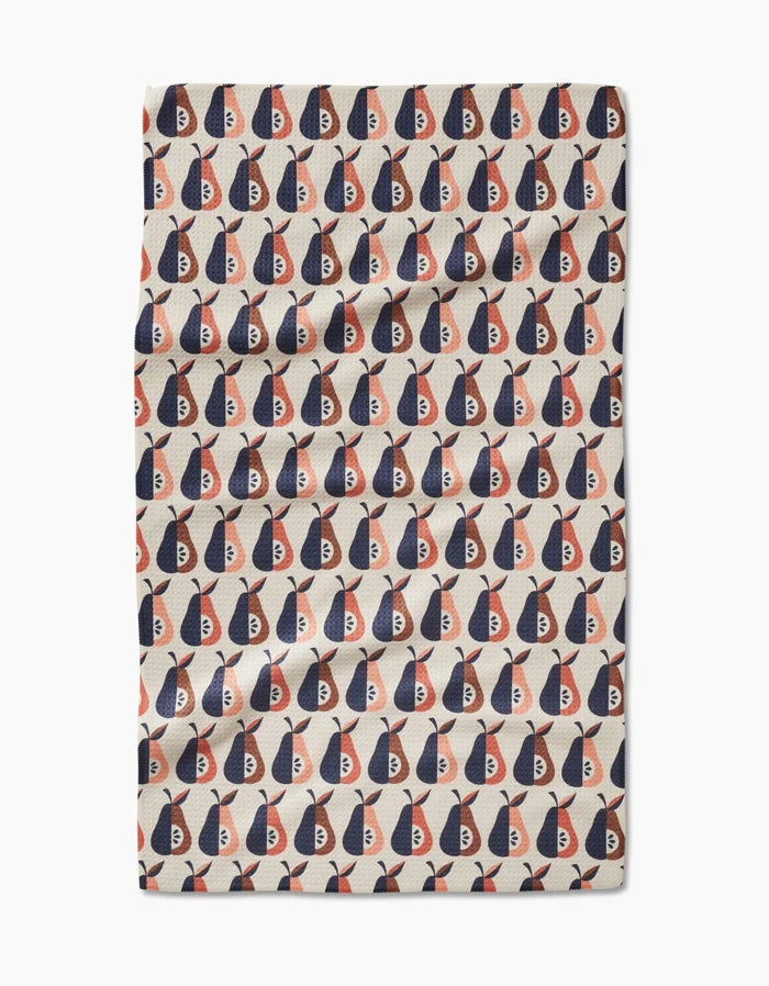 The Retro Pears tea towel by Megan Kampa is beige and features a repeating pattern of red, navy, and white abstract shapes in neat rows and columns.