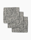 The Rhythm Current Stripes dishcloth set by Sarah Daugherty features three folded rectangular napkins with a black and white geometric pattern, made from recycled materials for a chic, eco-friendly addition to your home.