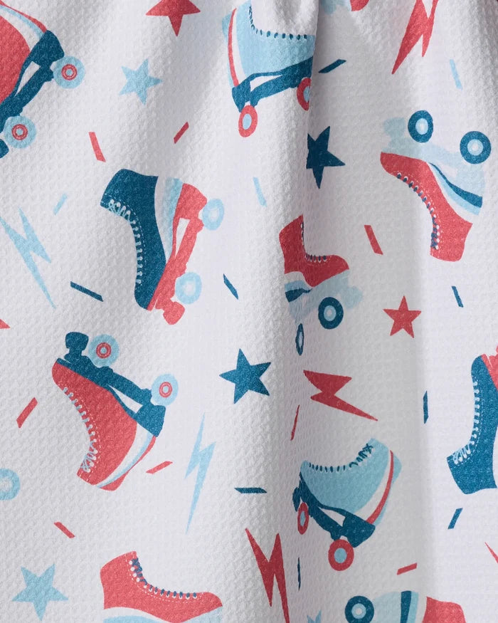 The Rolling With Stars tea towel by Hufton Studio features a playful red and blue roller skate, star, and lightning bolt pattern on textured white fabric made from recycled materials.