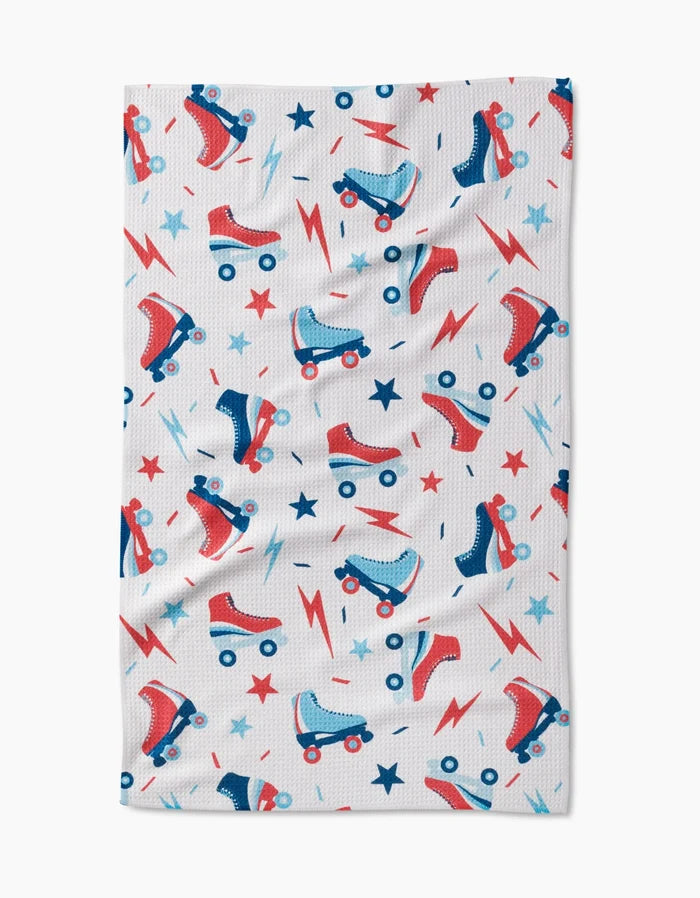 The Rolling With Stars Geoweave cloth by Hufton Studio features a white ultra-absorbent surface with vibrant red and blue roller skates, lightning bolts, and stars.