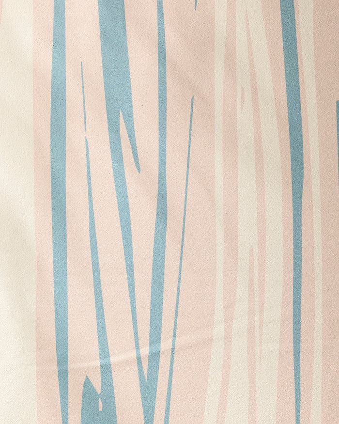 The GEOMETRY Root yoga towel showcases an abstract pattern with pale pink and light blue wavy vertical lines on a creamy off-white background, combining style and non-slip function for your yoga practice.