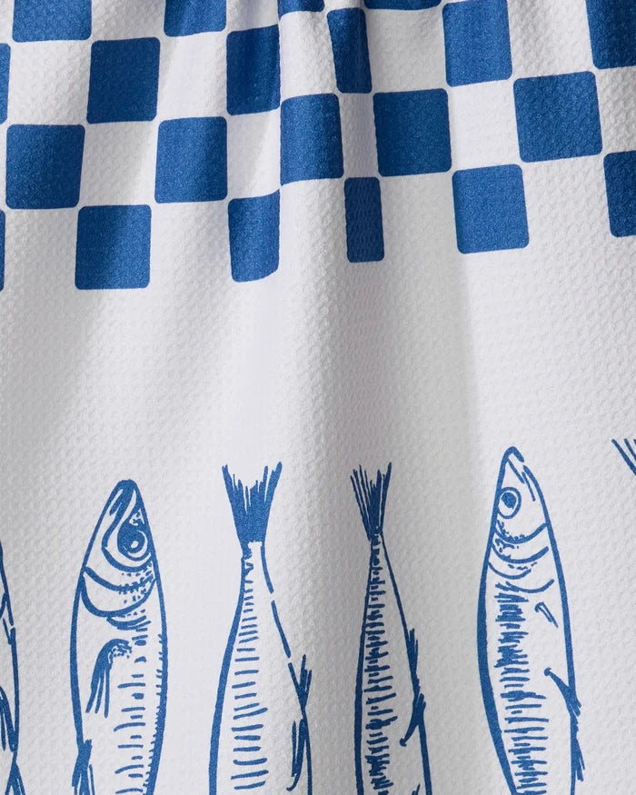 The Sardine Check Blue tea towel by Hufton Studio is white with blue check patterns at the top and vertical blue fish sketches along the bottom.