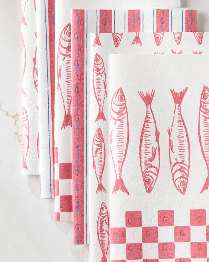 Several "Sardine Check Red" reusable paper towels by Hufton Studio, each with red fish and checkerboard designs plus blue and red edge lines, are arranged overlapping on a white surface.