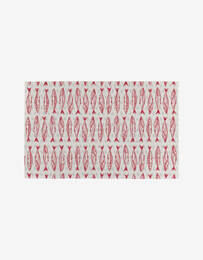 Sardine Check Red by Hufton Studio is a rectangular cloth with a repeating red fish design on white, created as an eco-friendly alternative to reusable paper towels.