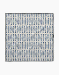 The Sardine Stripes mat by Hufton Studio is a rectangular white mat made from recycled materials, featuring rows of evenly spaced vertical blue fish and a black border.