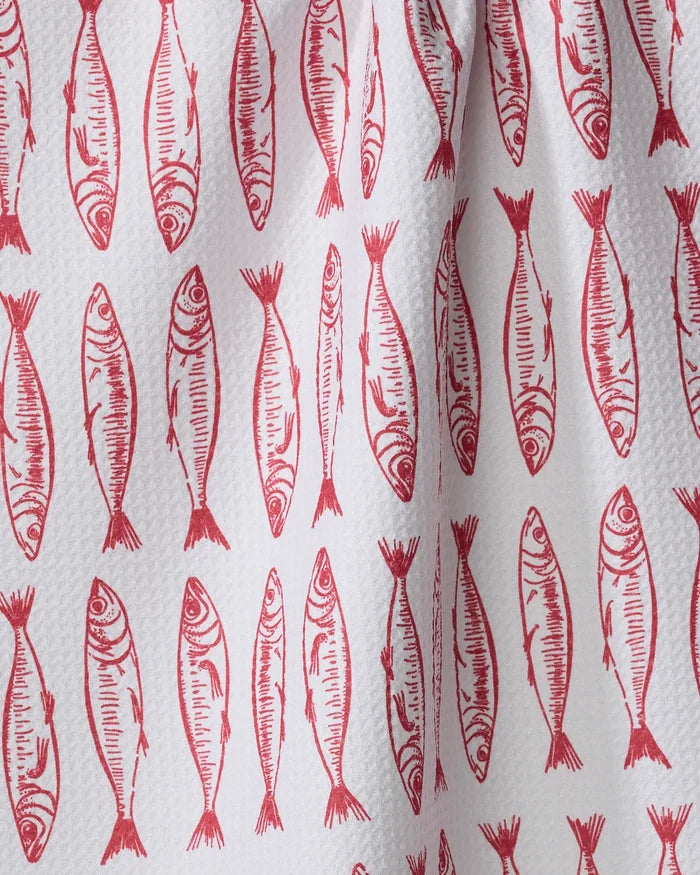 A close-up of Hufton Studio's "Sardine Stripes" tea towel—an eco-friendly white towel with red, hand-drawn sardine illustrations in vertical rows.