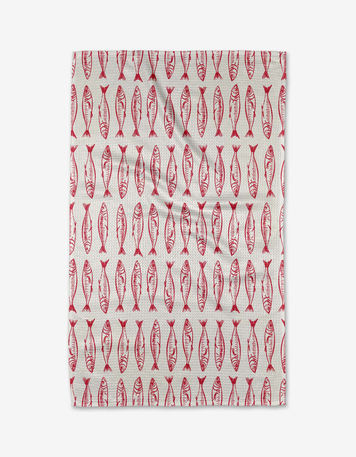 The Sardine Stripes tea towel by Hufton Studio features red, stylized fish in neat vertical rows on white, creating a symmetrical pattern. Made from sustainable materials.