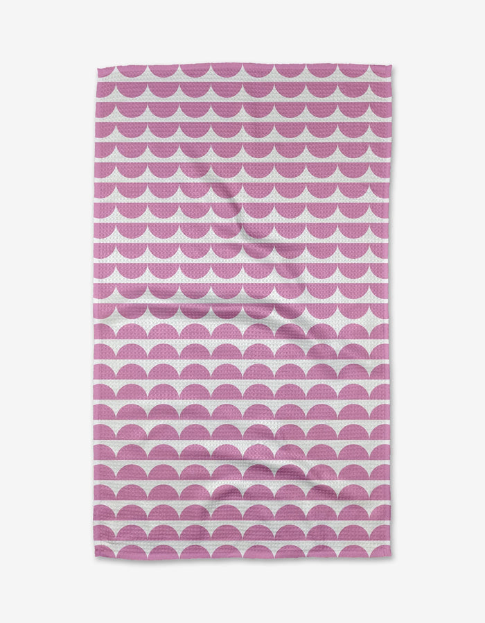 The Buy Guides Scallops - Pink towel is made from ultra-absorbent Geoweave fabric and showcases a modern geometric pattern of overlapping pink and white scallops on a white background.
