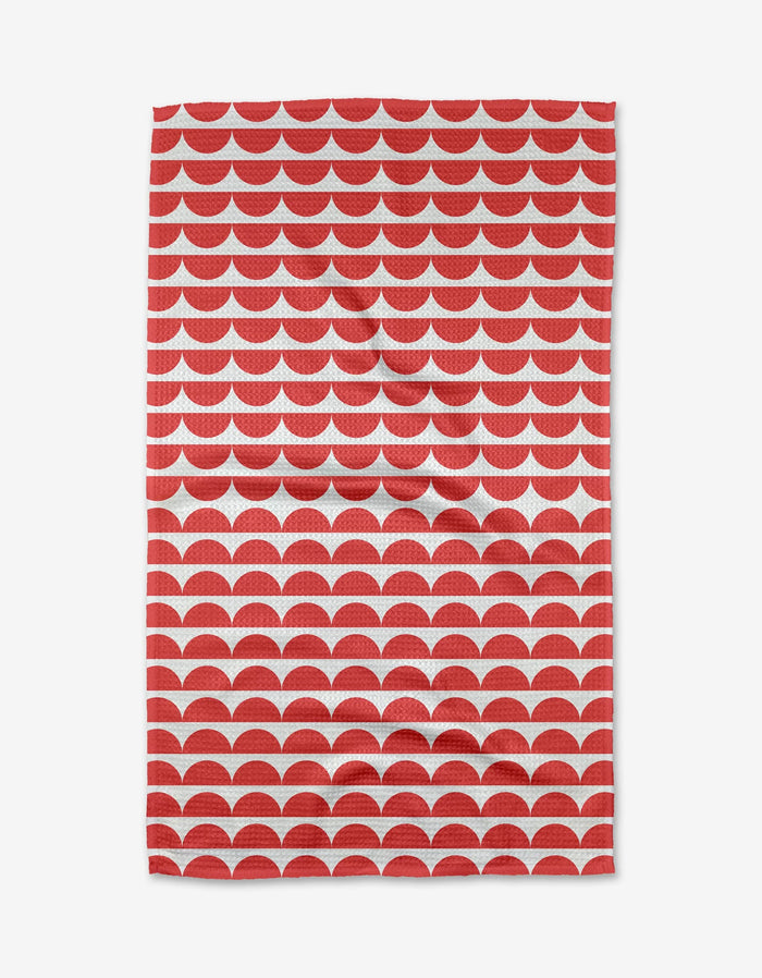 The Buy Guide’s Scallops - Red features a rectangular Geoweave fabric with overlapping red semicircles on white, creating a stylish, ultra-absorbent, and functional scalloped design.