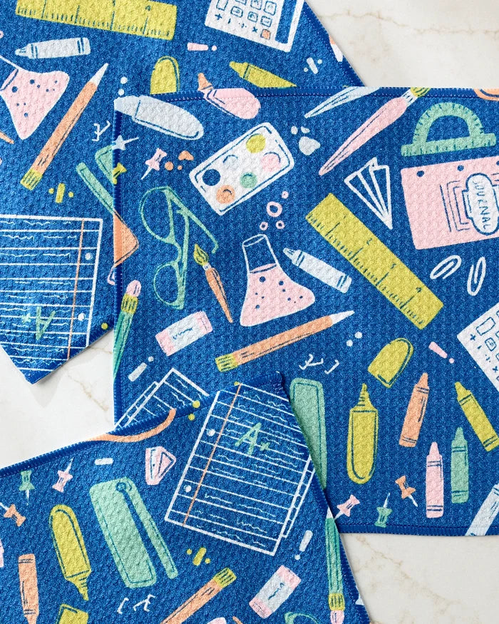 The Amy MacCready "School Days" super-absorbent blue dishtowel set features colorful school supplies illustrations for a fun and practical kitchen accent.