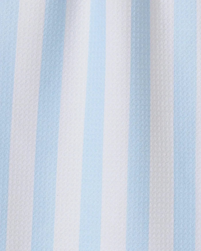 The GEOMETRY Seaside Stripes towel features vertical alternating pale blue and white stripes on textured fabric, making it a stylish and quick-drying choice for any kitchen.