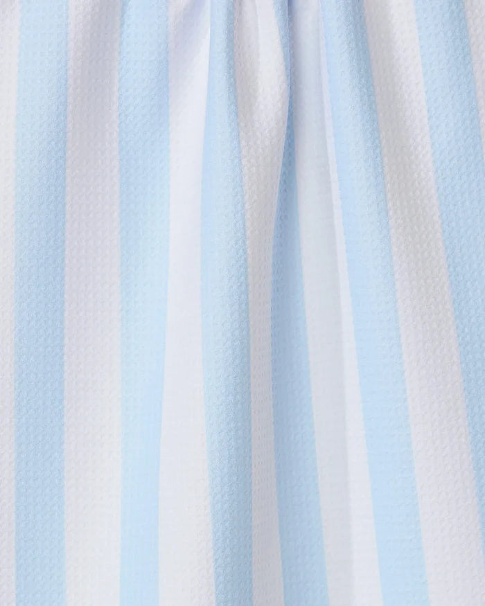 Close-up of the GEOMETRY Seaside Stripes recycled kitchen towel, showcasing its light blue and white vertical stripes, textured surface, and gentle folds.