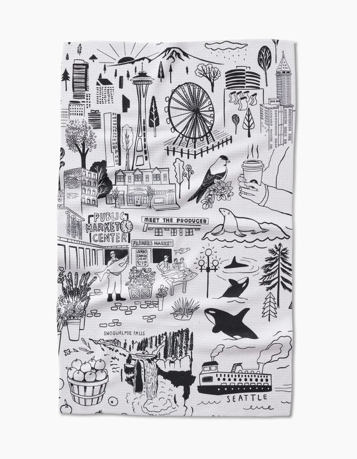 The Seattle Tea Towel by Elisabeth Wing features black and white hand-drawn illustrations of city landmarks, local foods, and coffee. Made with recycled materials for eco-friendly charm.