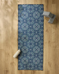 A package of Seeds and Nuts by Twig + Spark rests on a wooden floor, with a water bottle and yoga blocks stacked nearby.