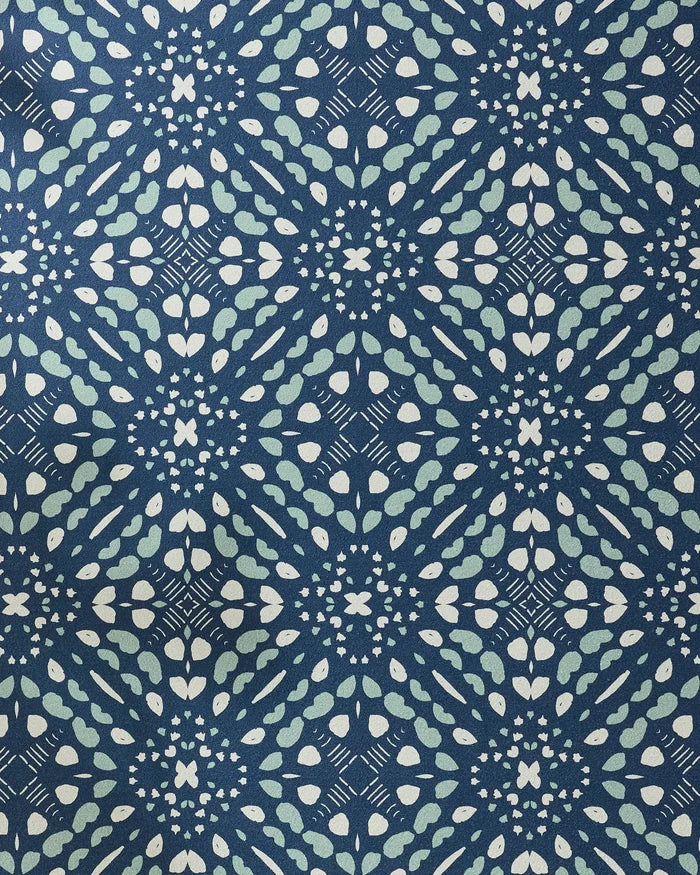 Seeds and Nuts by Twig + Spark: A blue and white geometric fabric with repeating diamond shapes and curved lines, creating a textured, symmetrical look—ideal for a stylish non-slip yoga towel.