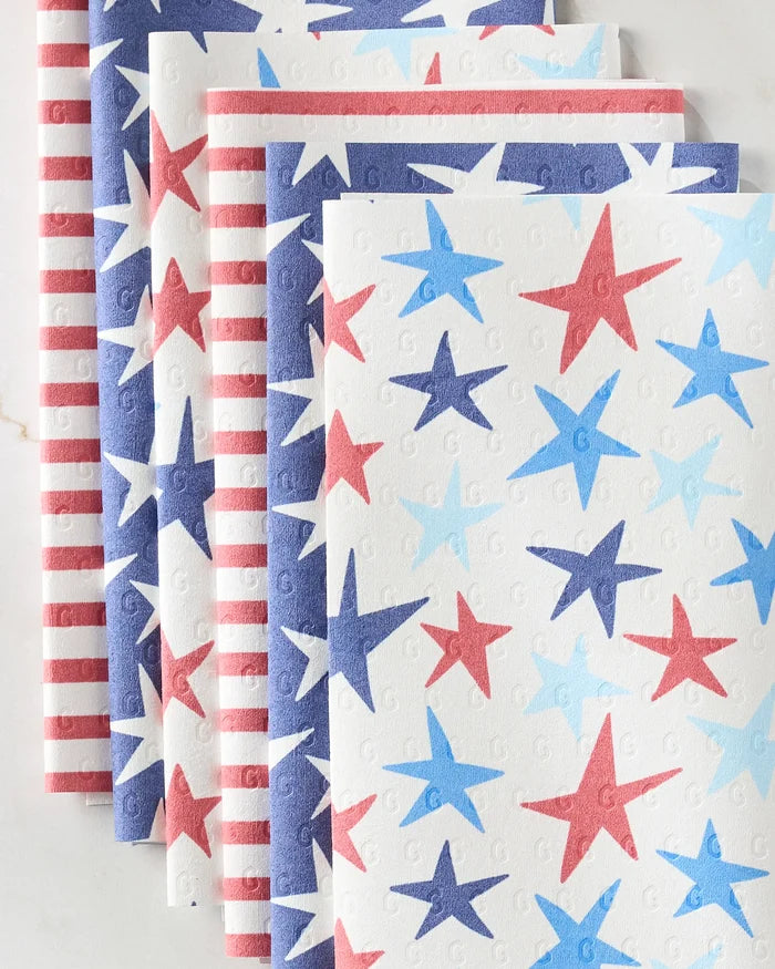 Mindfulnice Seeing Stars napkins feature red, white, and blue star and stripe designs in a neat stack—perfect reusable paper towels for an eco-friendly patriotic celebration.