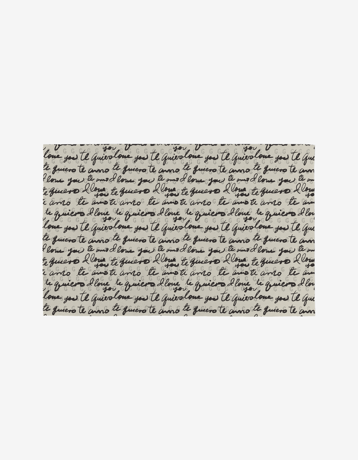 Black ink handwriting repeats je t’aime and te quiero (I love you in French and Spanish) on a white background—featured on Danelys Sidron’s Self Love Not Paper Towels, made with eco-friendly materials.