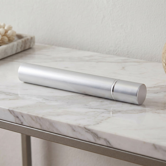 Silver scattering tube on a marble surface