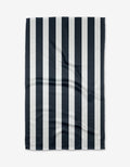 A rectangular BetterDays Sleep Geoweave fabric with evenly spaced vertical black and white stripes is shown flat on a white background, displaying subtle creases and folds on its ultra-absorbent surface.