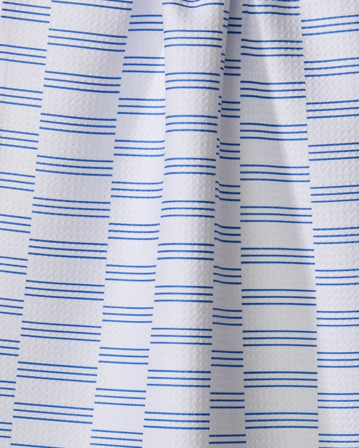 A close-up of The Buy Guide’s Small Stripe - Navy tea towel shows white, textured recycled fabric with evenly spaced navy blue stripes and soft vertical folds.