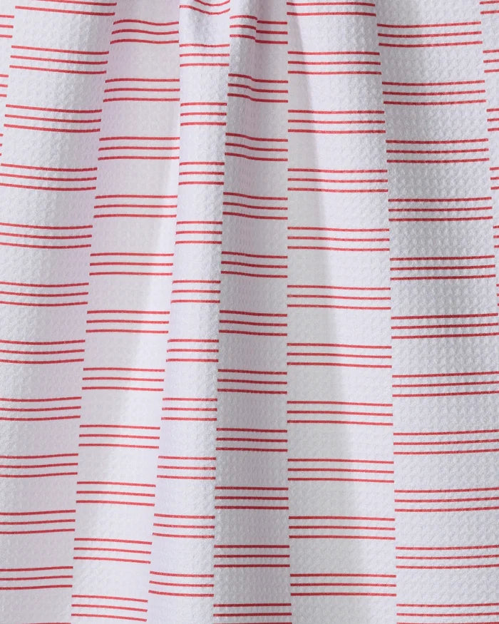 The Buy Guide’s Small Stripe - Red kitchen towel features eco-friendly white textured fabric with paired horizontal red lines in a simple geometric pattern, draped to show gentle vertical folds and subtle shadows.