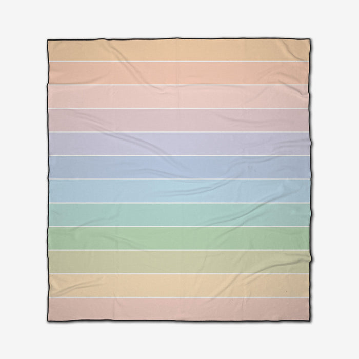 The GEOMETRY Smarties is a square beach blanket featuring horizontal pastel stripes in peach, pink, lavender, blue, green, and mint with thin white lines between each. The quick-drying fabric also shows faint creases.