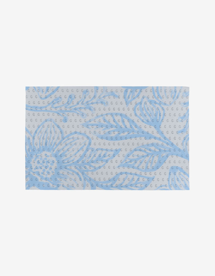 The GEOMETRY Something Blue features a rectangular light gray fabric with blue flowers, leaves, and scattered blue dots—an eco-friendly alternative to Not Paper Towels.