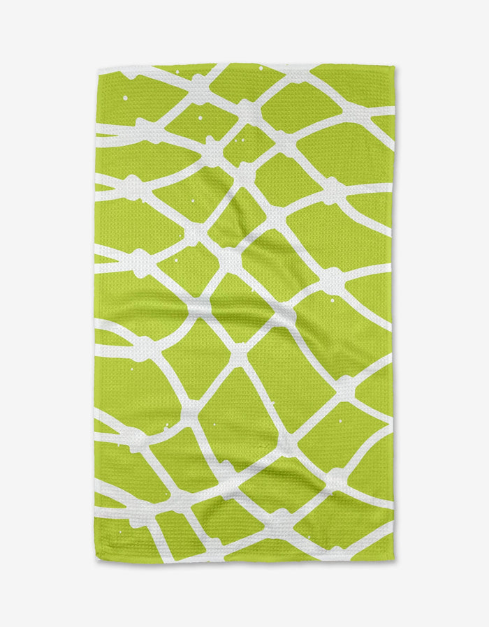 The Splash towel by Sissy Moon features a green color with a white abstract net-like pattern, made from ultra-absorbent Geoweave fabric, and is displayed flat against a white background.