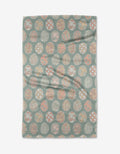 The Spring Easter Eggs kitchen towel by Hufton Studio is a rectangular recycled towel adorned with pastel-colored circular designs featuring floral and geometric motifs on a muted teal background.