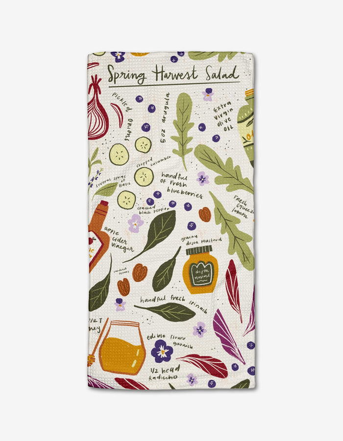 The Spring Harvest Salad tea towel by Janna Sue Design features vibrant Geoweave fabric with colorful illustrations of spring salad ingredients and the product name at the top—a lively addition to your kitchen.