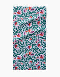 Spring Wavy Leaves by Claire Iglesias is a rectangular bar towel made from recycled materials, featuring a vibrant pattern of green leafy branches, heart-shaped red and pink flowers, and purple accents on white fabric.