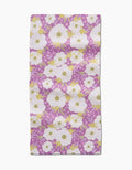 The Ashley Celena Springtime Floral Rectangular Bar Towel features white and yellow flowers with green leaves on purple Geoweave fabric, creating a vibrant, decorative accent for any space.