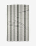 The Becki Owens Spruce tea towel is rectangular, white, and eco-friendly, with evenly spaced vertical dark green and light gray stripes—perfect for everyday kitchen use. Shown flat on a plain white background.