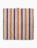 The Megan Roy Squirrels Stripe dog towel features a soft, ultra-absorbent square design with vertical brown, orange, and beige stripes on white, shown laid flat on a plain white surface.