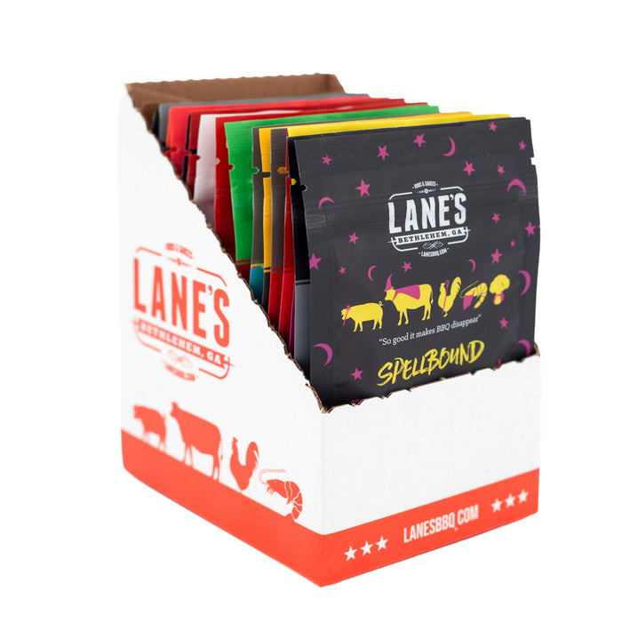 Display of Lanes BBQ packets with colorful packaging on a white background