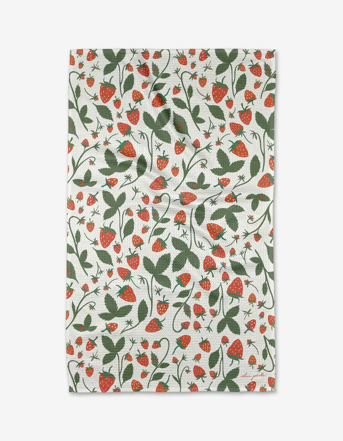 The Strawberries tea towel by Elana Gabrielle features a repeating pattern of red strawberries, green leaves, and vines on white Geoweave™ fabric for enhanced absorbency and style.