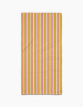 The Geometry Stripe Mania napkin, made from Geoweave fabric, features vertical yellow, pink, and white stripes and is displayed flat on a white background.