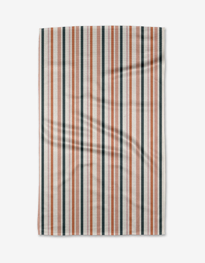 Stripes For Days by Charlie Rowan Designs: a rectangular ultra-absorbent Geoweave fabric towel with orange, black, and white vertical stripes, shown flat against a white background with some visible folds and creases.