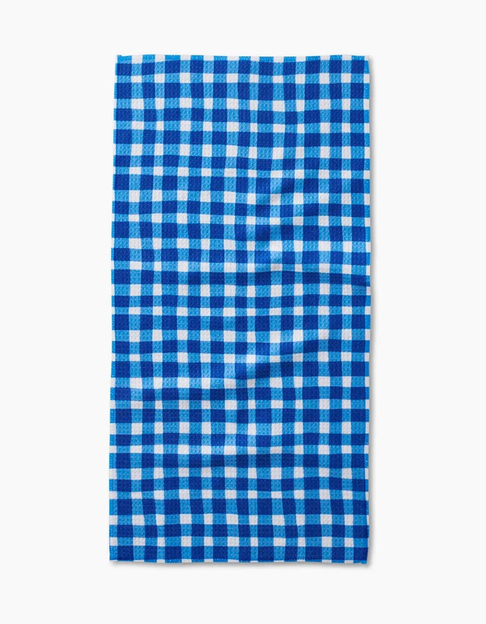 The Danelys Sidron Summer Plaid bar towel, crafted from ultra-absorbent Geoweave fabric, showcases a blue and white checkered pattern and is displayed flat on a white background.
