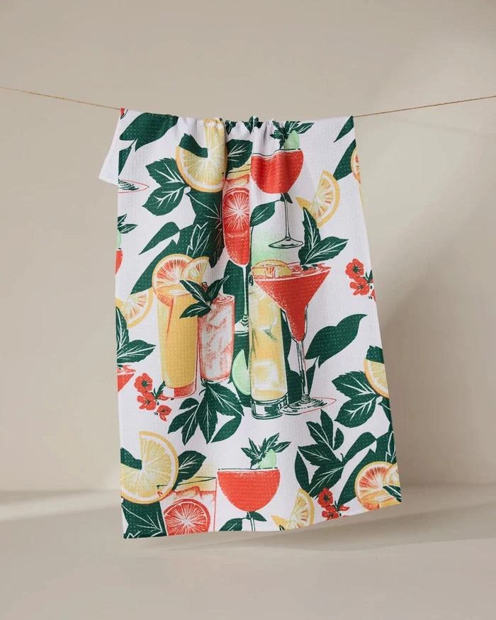 The Summer Refreshments recycled kitchen towel by Geometry features vibrant cocktails, citrus fruits, and green foliage on a white background for a colorful, eco-friendly touch.