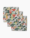The Geometry Summer Refreshments set includes three folded cloth napkins made from recycled materials, featuring colorful cocktails, green leaves, and vibrant citrus fruit slices on a white background.