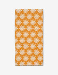 The Kayla Ann Sunshine Smile bar towel is a rectangular orange towel made from Geoweave fabric, featuring an evenly spaced repeating pattern of white sun-like shapes, shown on a plain white background.
