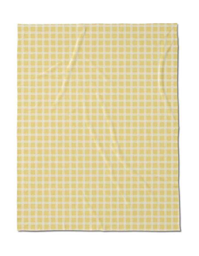 The Geometry Sunspread is a square fabric with a yellow and white gingham check pattern with small, even squares. Made from recycled materials, it features a lightly wrinkled texture.