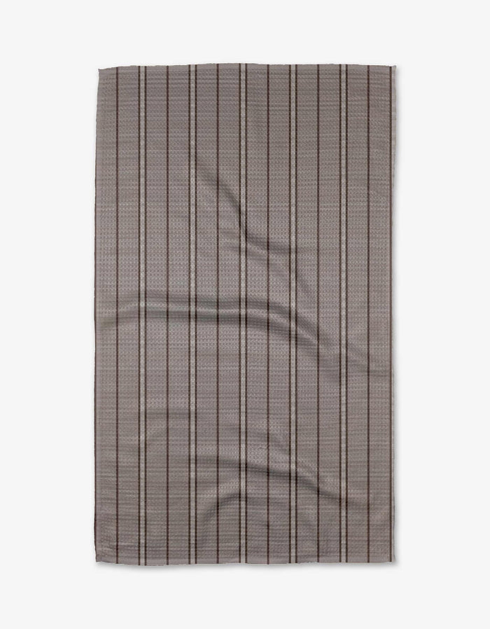 The Buy Guides Super Stripe - Chocolate is a rectangular, flat Geoweave fabric in gray with a subtle checkered pattern and thin, evenly spaced vertical black stripes, shown slightly wrinkled on a white background.