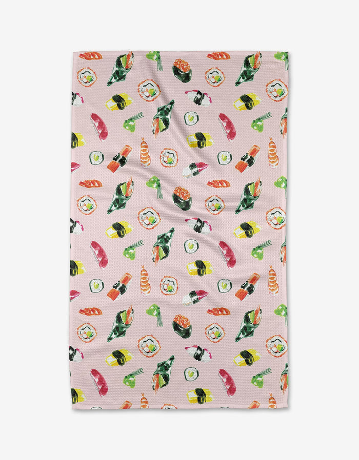 The Sushi in Tokyo tea towel by Travel Write Draw features a vibrant sushi pattern—nigiri, maki rolls, and hand rolls—on pink Geoweave™ fabric made from recycled materials. Designed by Meagan Morrison.