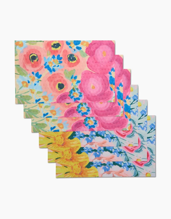Suzzy and Margot by Ania Zwara Art: a set of six rectangular cloths with vibrant pink, yellow, orange, and blue floral patterns on a light background—an eco-friendly alternative to Not Paper Towels—arranged in a staggered overlap.