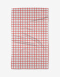 The Kailee Wright Sweet Peppermint is a white tea towel with a red grid pattern and absorbent fabric, shown slightly wrinkled against a plain white background.