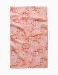 The Sweet Pumpkin Harvest by Ashley Celena is a peach recycled kitchen towel with hand-drawn pumpkins, white daisies, and orange floral accents. Ultra-absorbent with a charming, slightly wrinkled finish.